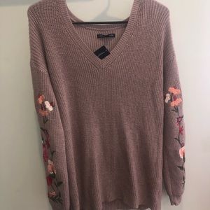 women’s sweater with flower pattern on sleeves